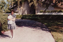 Linda Warren holding Kathrine Warren at child's christening 1989